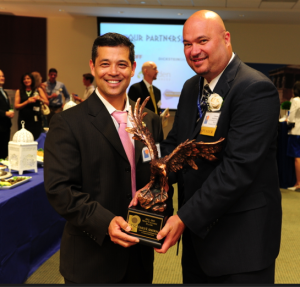 Mr. Guy Torres, Director of Information Technology Contracting at U.S. Customs and Border Protection, with GTSC's 2013 MVP Awardee, Mr. Charles R. Armstrong, Assistant Commissioner and Chief Information Officer at U.S. Customs and Border Protection. 